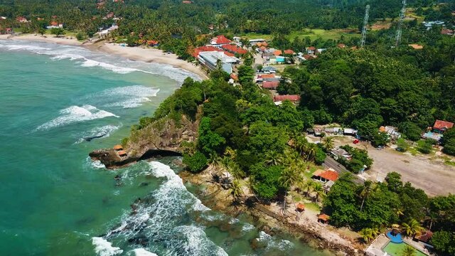 Aerial drone view of Beach and Its Wonderful Sunset View. At anyer beach with noise cloud. Banten, Indonesia, March 3, 2021
