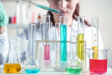 The laboratory assistant holding test tube