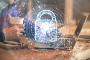 Multi exposure of man's hands holding and using a digital device and lock drawing. Security concept.
