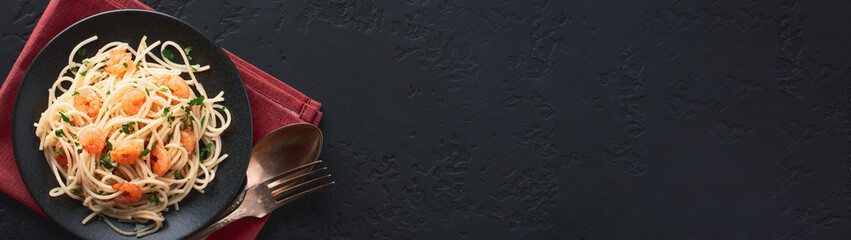 Spaghetti shrimp scampi in a plate banner with free space for text