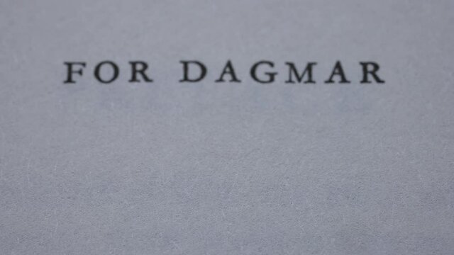Detailed view of the English text for Dagmar on the page of an open book. Zoom in, the text becomes slightly blurry. Slow motion. Close up.