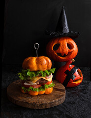 Funny pumpkin burger with a big cutlet. Halloween - 417822409