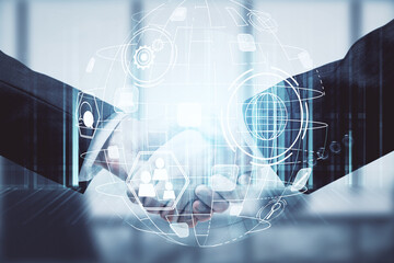 Double exposure of social network theme hologram and handshake of two men.