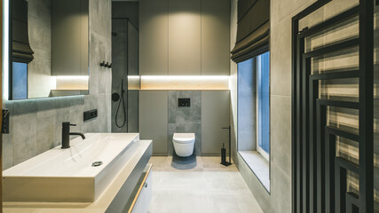 Fototapeta na wymiar Modern interior in grey tones of bathroom in luxury apartment.