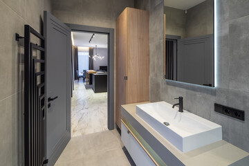 Modern interior in grey tones of bathroom in luxury apartment.