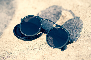 Steampunk sunglasses with big round lens shoot outside in a sunny day closeup. Selective Focus. High quality photo