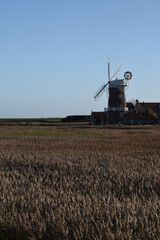 Fototapeta premium Cley Mill on a bright, sunny day. North Norfolk, UK