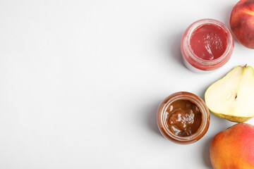 Flat lay composition with healthy baby food and ingredients on light background. Space for text