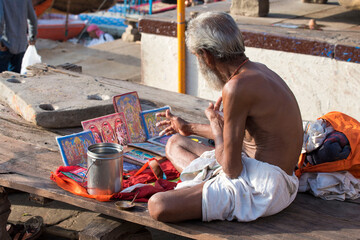 Varanasi / India 27 March 2018 A Brahmin Priest worshipping sitting on the ghats of Varanasi in...