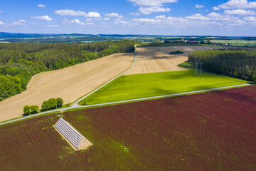 Crimson clover field and heap of bales from above