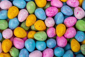 Fototapeta na wymiar Frame filling pile of colorful shiny Easter eggs