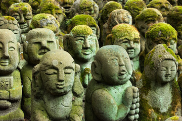 Fototapeta na wymiar Buddhist stone statues at the Otagi Nenbutsu ji temple in Kyoto, Japan