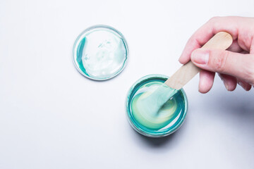 jar with paint emerald, green, sea water color beautiful trend color