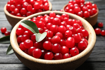 Ripe fresh cranberry on grey wooden table, closeup