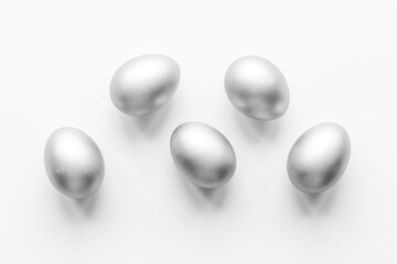 Silver eggs isolated on white background. Easter decoration background. Top view
