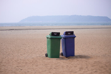 Recycling dustbin rubbish on beach.