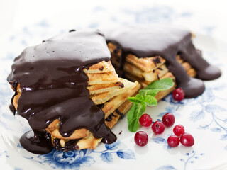 waffles in a shape of hearts topped with hot chocolate