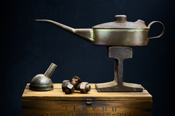Oil can and spout with bolts and nuts fine art still life.  - 417832803