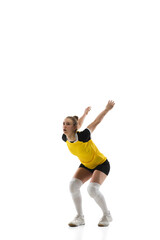 Flyer. Young female volleyball player isolated on white studio background. Woman in sportswear training and practicing in action, flight. Concept of sport, healthy lifestyle, motion and movement.