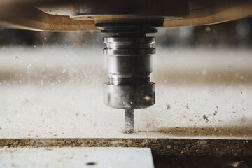 Close-up shot of cutting wood with a cnc milling machines. © Ilshat