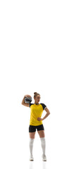 Fototapeta na wymiar Flyer. Young female volleyball player isolated on white studio background. Woman in sportswear training and practicing in action, flight. Concept of sport, healthy lifestyle, motion and movement.