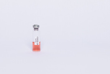 ampoule with coronavirus vaccine on white background