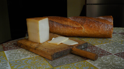 table with slice cheese and bread