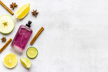 Flat lay of men perfume with flowers and citrus. Top view