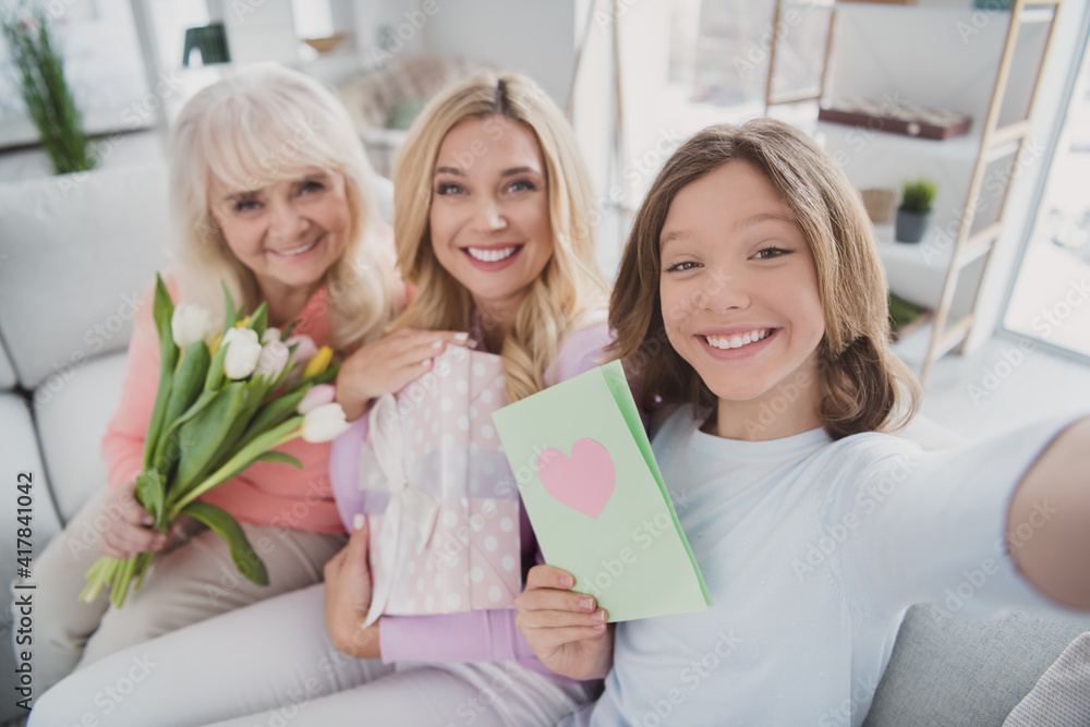 Sticker Photo portrait of granny daughter mother celebrating 8 march together keeping flowers postcard gift taking selfie