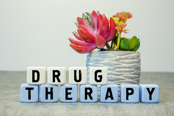 Soft cubes with the abbreviation DRUG THERAPY with a flower