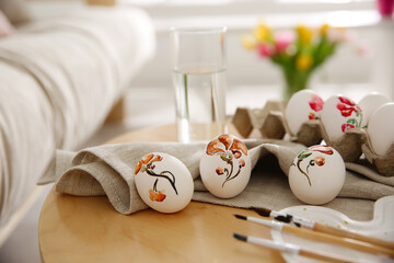 Beautifully painted Easter eggs on wooden table