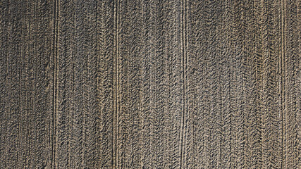 Arial drone view of freshly plowed field ready for seeding and planting in spring.  Farmland. Empty...