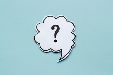 Question mark symbol on speech bubble, top view