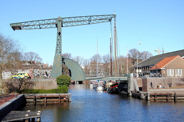 Green steel/iron drawbridge (1902) at the end of the canal lock of the Entrepotdok (Warehouse...