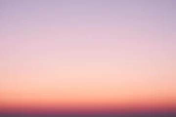 Foto op Plexiglas wazig zonsondergang nacht hemelachtergrond voor zomerseizoen concept. © AlexLit