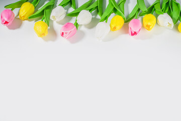 Easter Background Tulips Bouquet, Big Colorful Tulip Flower Bouquet on white table background top view copy space for text