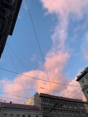 pink clouds in the blue sky