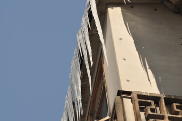 Icicles hang from the roof of the balcony