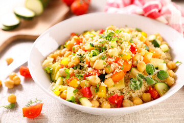 bowl of vegetarian couscous and ingredients