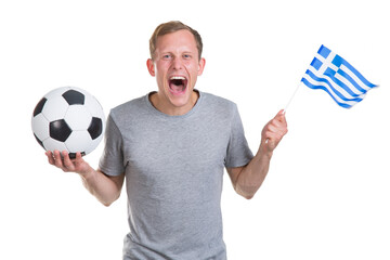 Young man with a soccer ball and the flag of Greece. Sports soccer fan.