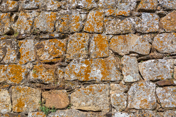 Architecture textures, detailed and rustic of paired masonry granite wall
