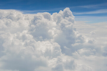 over the clouds,Blue sky with tiny clouds background Beautiful natural view from airplane window above. Background or Wallpaper.blue sky and cloud sky nature.Top view of aircraft