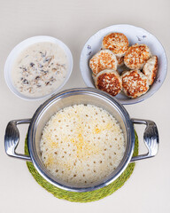 The plate of cutlets with rice and mushroom sauce