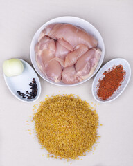 The ingredients for cooking chicken with bulgur