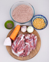 The ingredients for cooking traditional uzbek "pilaf" with rice and lamb