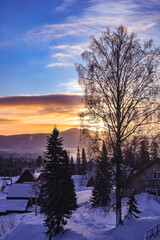 dawn in winter in the village