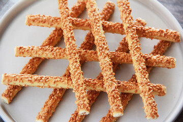 long salted sticks of crackers with sesame sprinkles