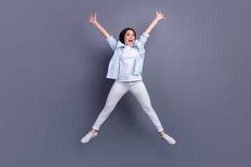 Fototapeta premium Full length photo of pretty charming mature woman wear formal shirt jumping like star isolated grey color background