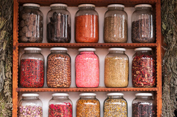 Jar with herbal tea, herbs and spices / Market stall with herbal tea, herbs and spices.