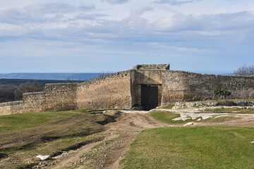 Fototapeta na wymiar iron-clad gate to a medieval city-fortress Chufut-Kale, Crimea